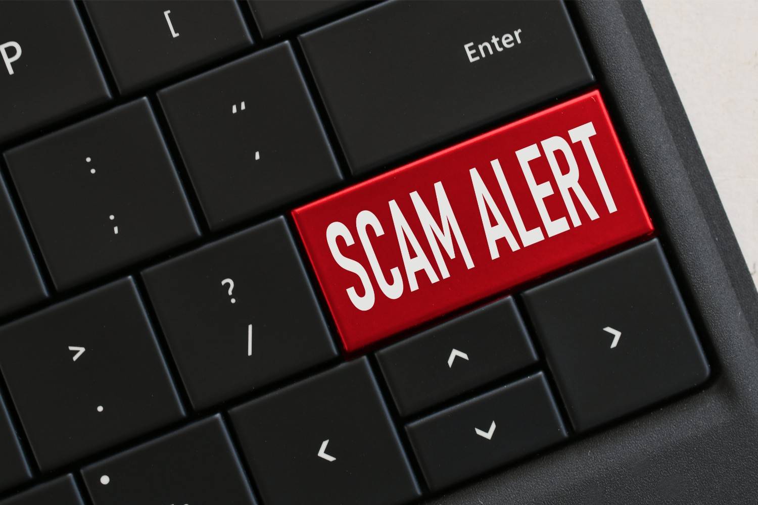 Scam alert keyboard key – immigration sponsorship fraud and serial sponsor scam warning