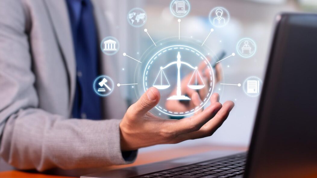 Immigration law concept showing justice scale hologram over laptop for F1 student visa denial and port of entry inspection