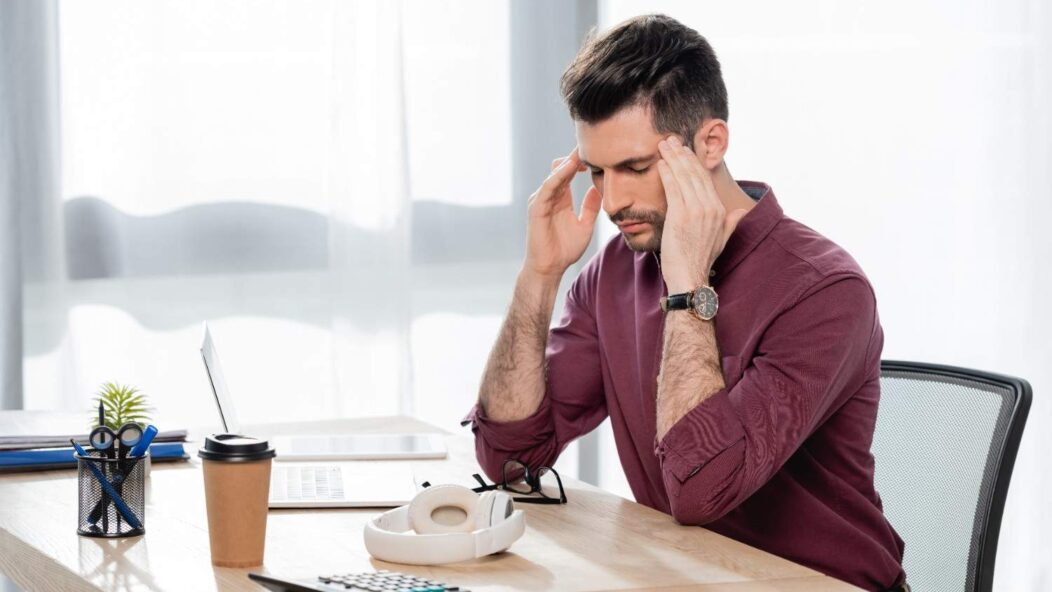 Stressed immigrant reviewing USCIS appointment notice – consequences of missing biometrics or RFE deadline