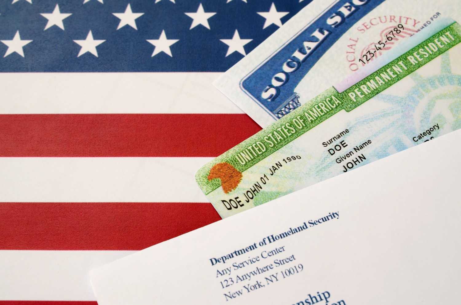 Adjustment of Status process green card and Social Security card on U.S. flag – AOS application for permanent residency in the United States