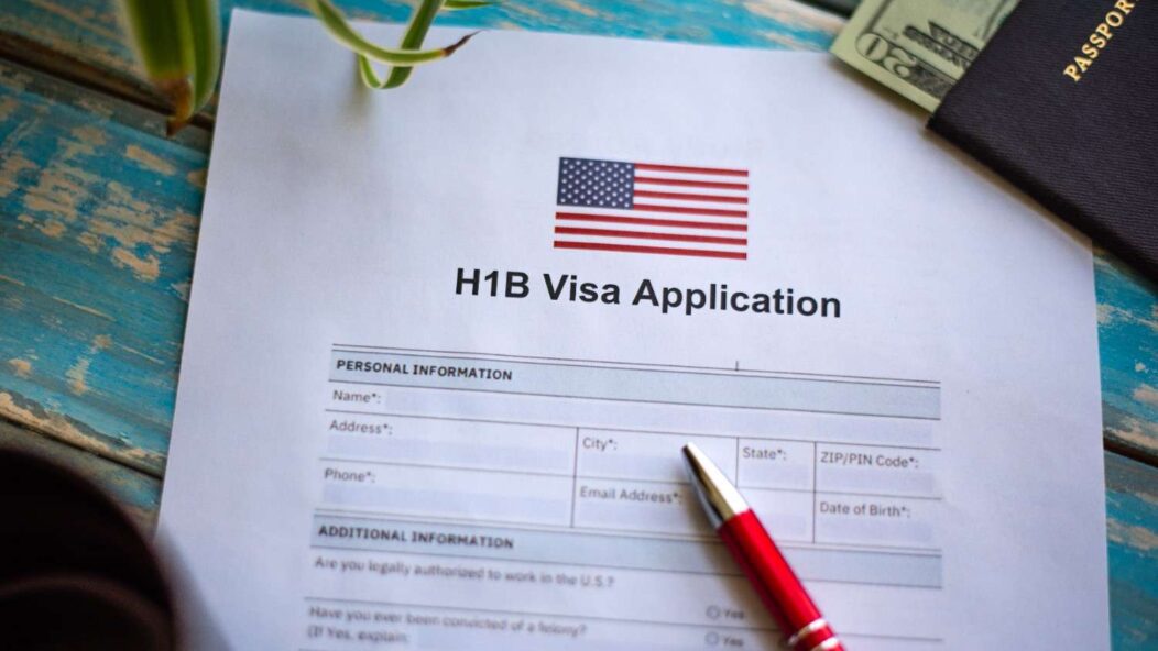 H1B visa application form with US flag and passport representing USCIS second H1B lottery selection FY 2025