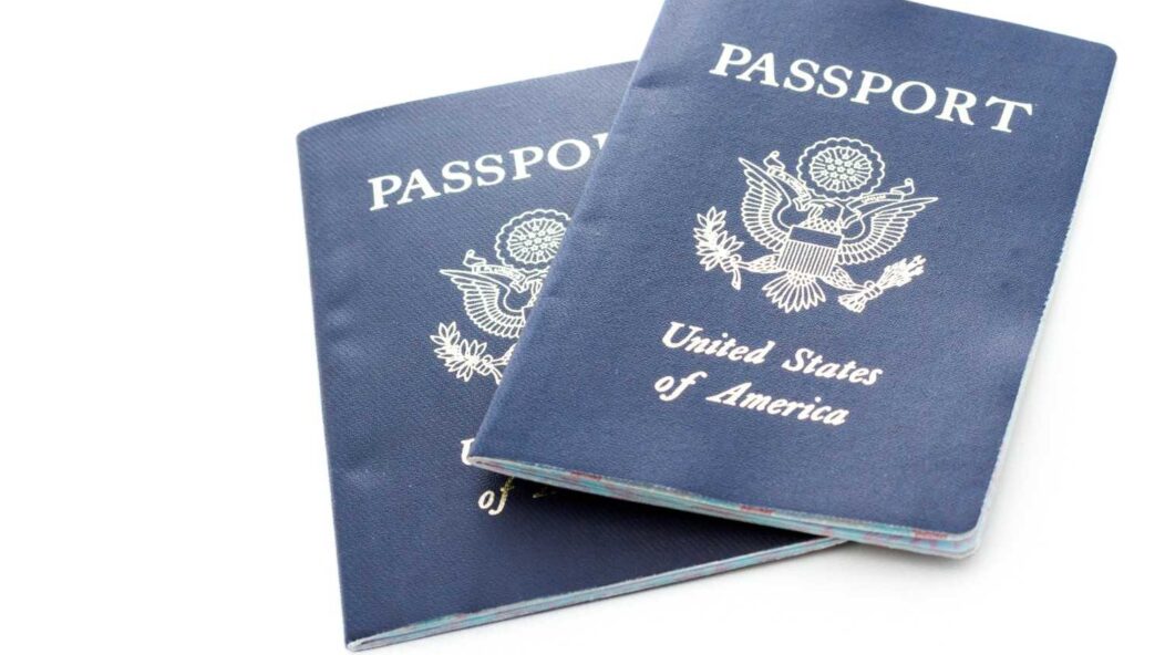 U.S. passports representing November 2024 Visa Bulletin updates and long green card backlogs for Indian immigrants
