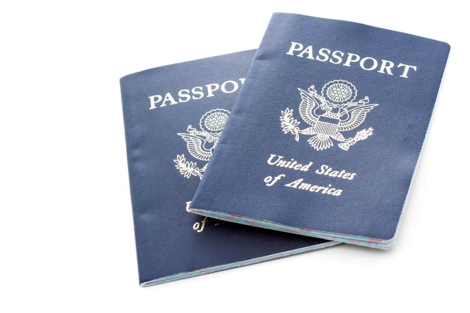 U.S. passports representing November 2024 Visa Bulletin updates and long green card backlogs for Indian immigrants