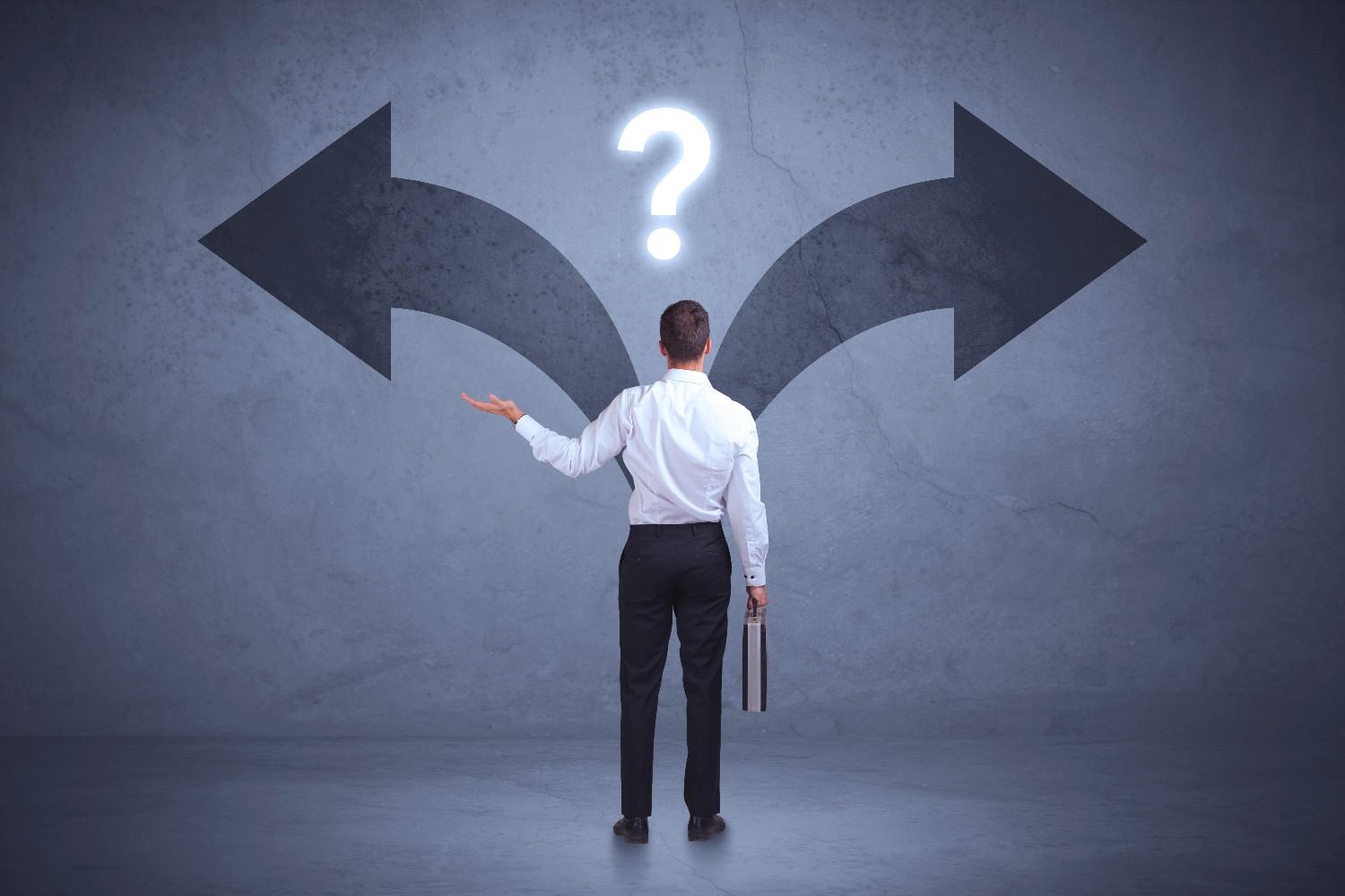 Business professional choosing between two directions – H1B visa document compliance and replacement decisions