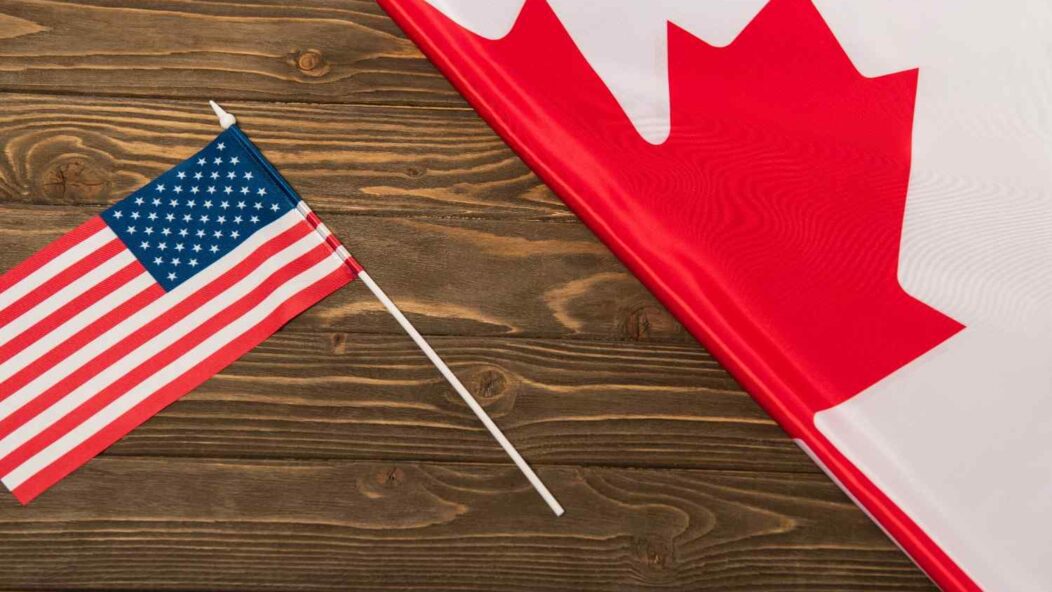 U.S. and Canada flags representing northern border migration and immigration policy issues