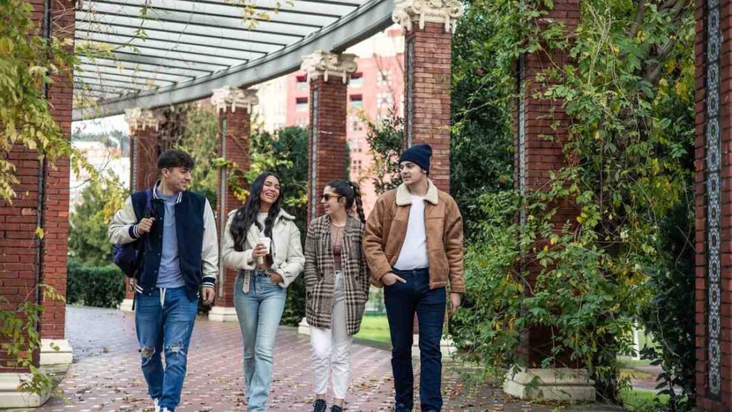International students walking on U.S. campus discussing OPT and STEM opportunities