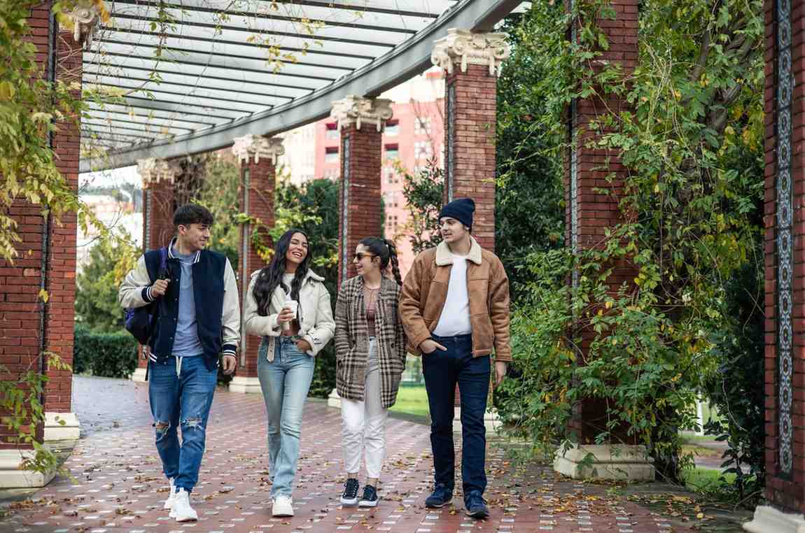International students walking on U.S. campus discussing OPT and STEM opportunities