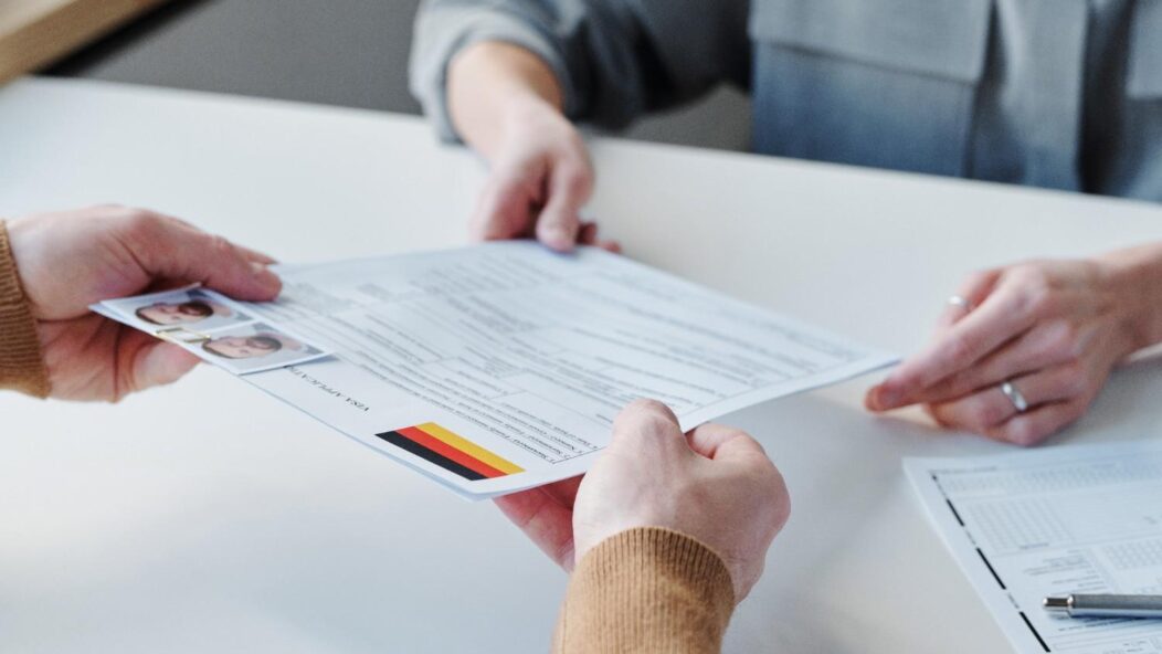 Submitting immigration visa application documents illustrating unused immigrant visas and visa cap process