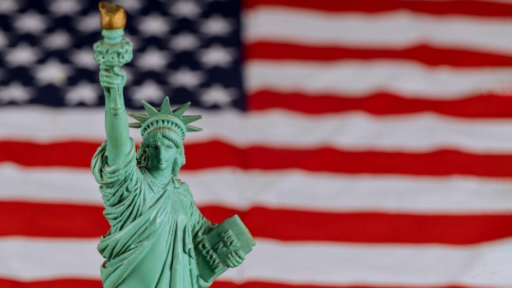 Statue of Liberty representing USCIS immigration policy updates and the 2024 CIS Ombudsman Report to Congress