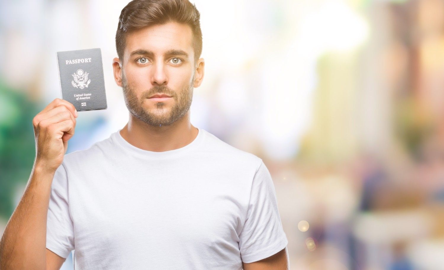 Man pointing to a blank clipboard, symbolizing the importance of filling Form I-129 correctly for USCIS compliance.
