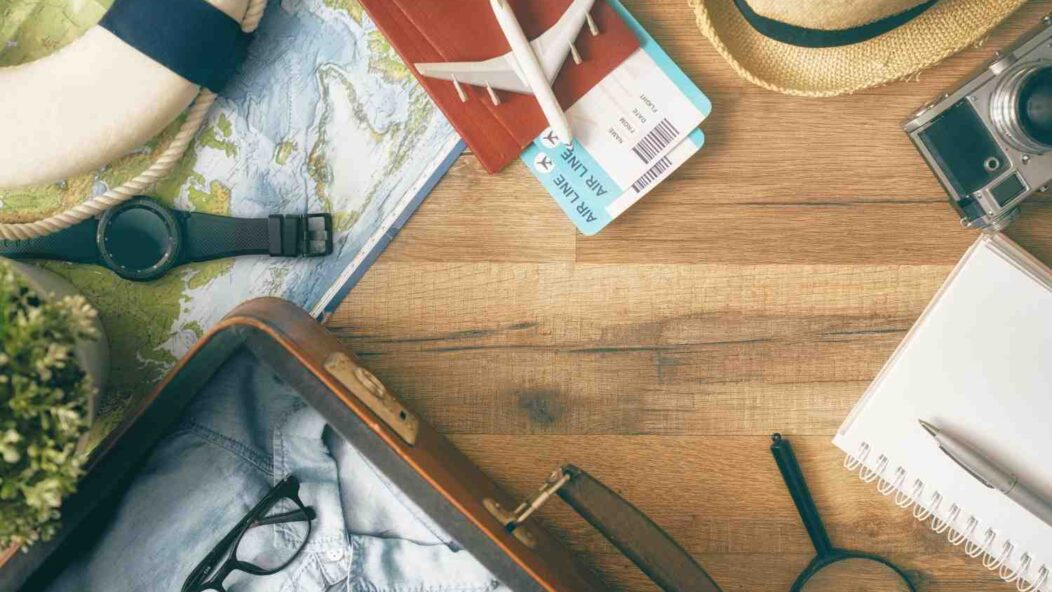 Travel essentials for handling visa revocations, including passports, maps, and magnifying glass for detailed immigration case research.