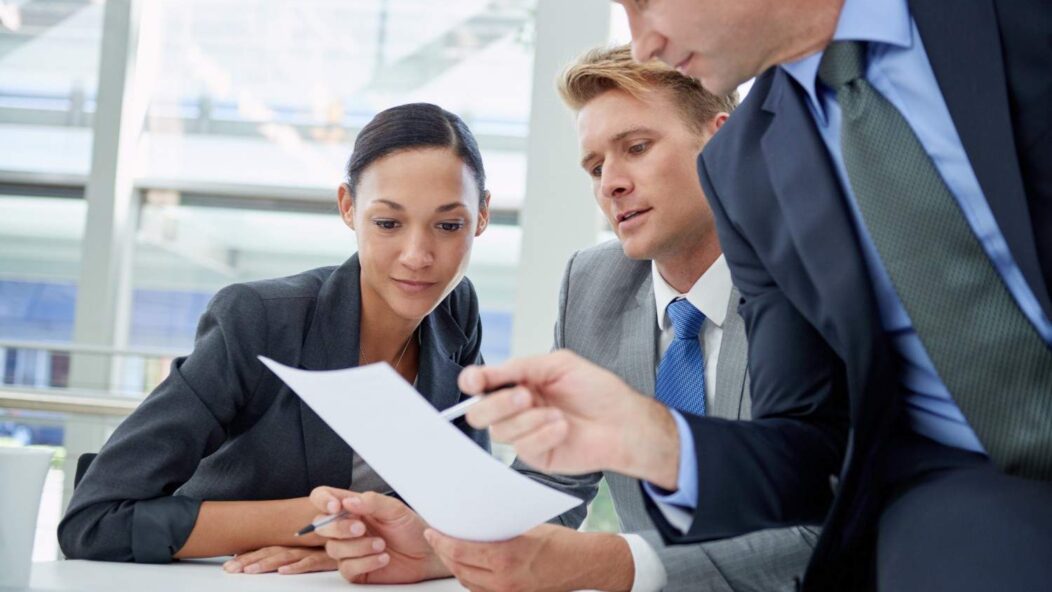 Team discussing responding to immigration inquiries and protecting business compliance.