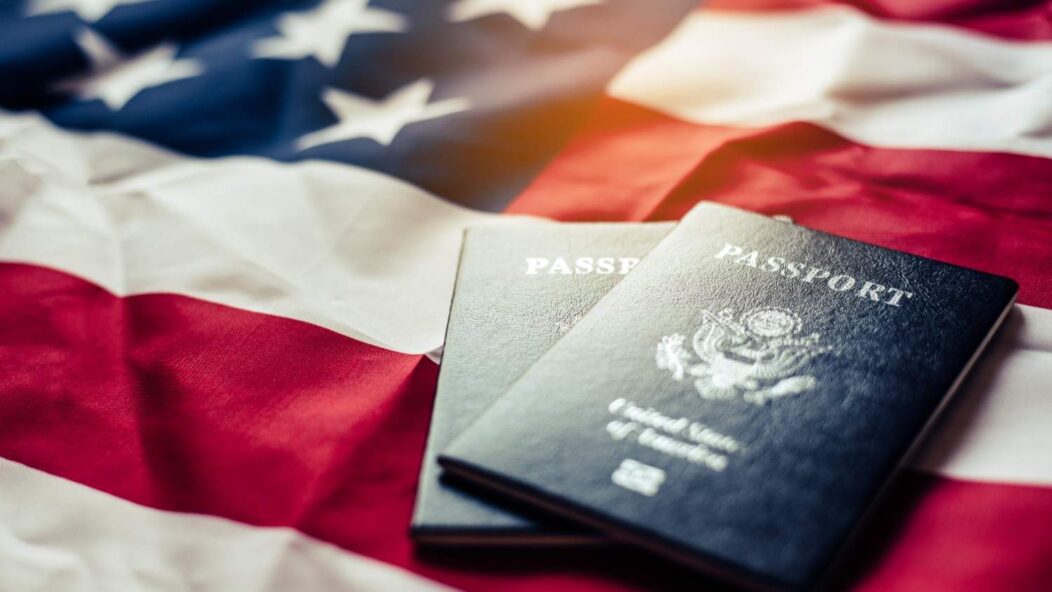 US Visa Trends India 2025: Statue of Liberty, American Flag, Passport, and Map Representing Travel and Immigration.