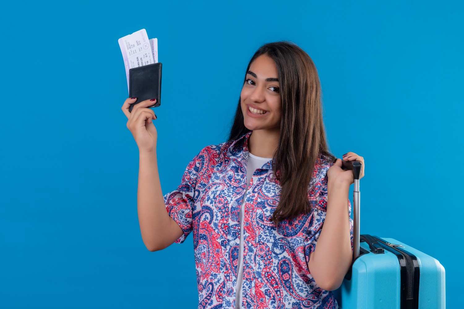 Young professional with a passport and travel bag, symbolizing TN Visa opportunities in 2025.