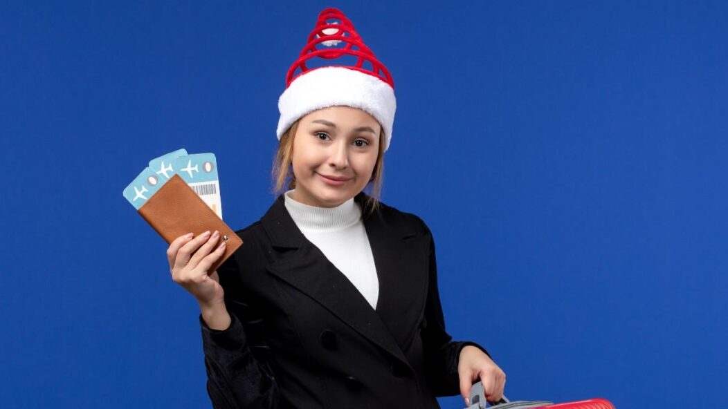 Professional holding travel documents and suitcase, symbolizing TN visa applicants navigating potential changes under Trump's policies in 2025.