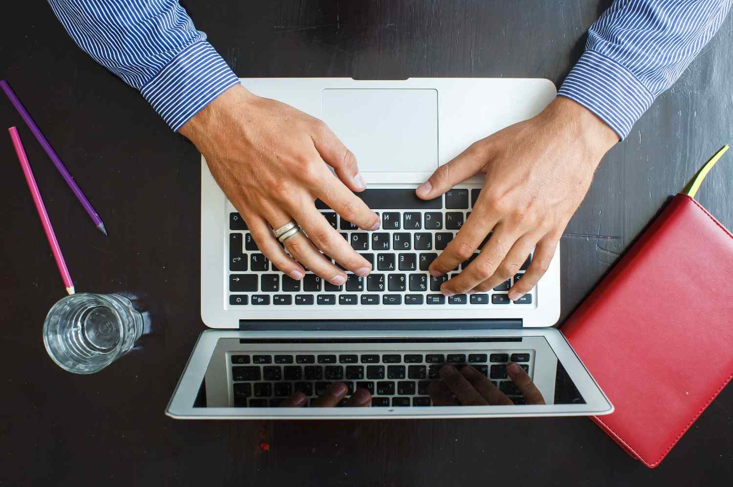 Immigration attorney working on PERM Labor Certification updates on laptop