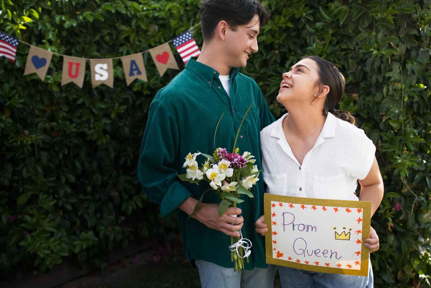 A couple celebrating prom with a "Prom Queen" sign, representing the complexities of marriage validity in U.S. immigration law.