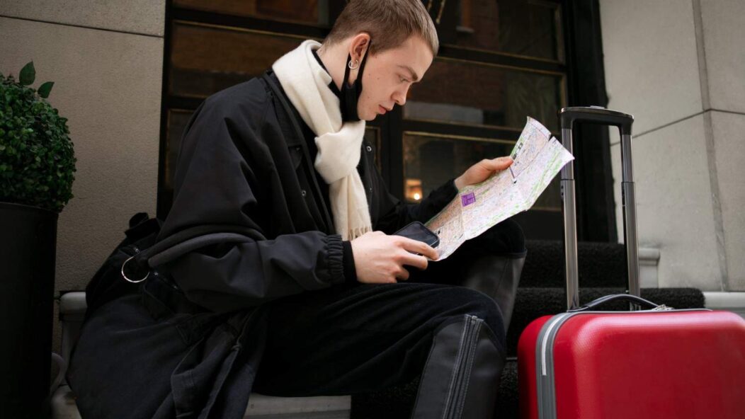 Traveler reviewing map while preparing for smooth entry into the U.S. with legal representation.