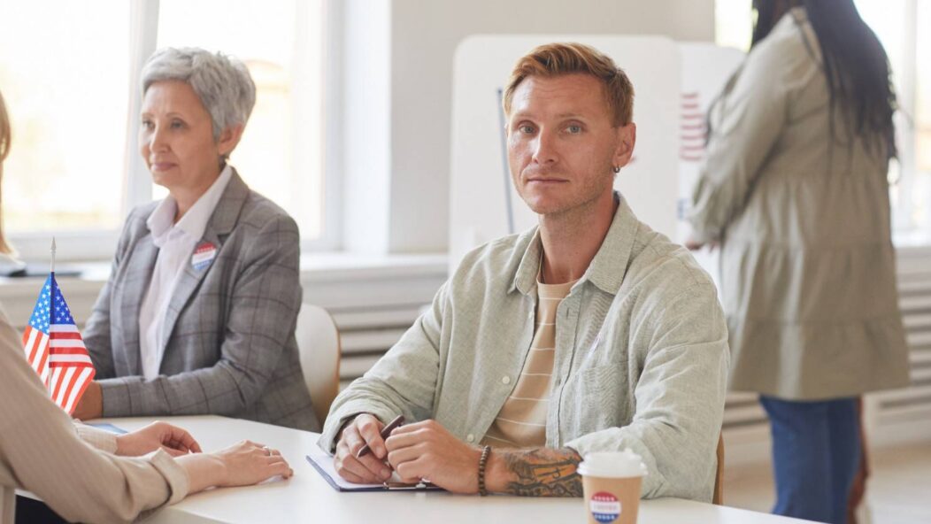 Immigrant filling out forms at US immigration process, preparing for secondary inspection
