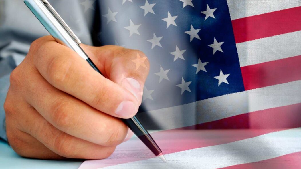 H-1B visa application form with American flag and legal documents on desk