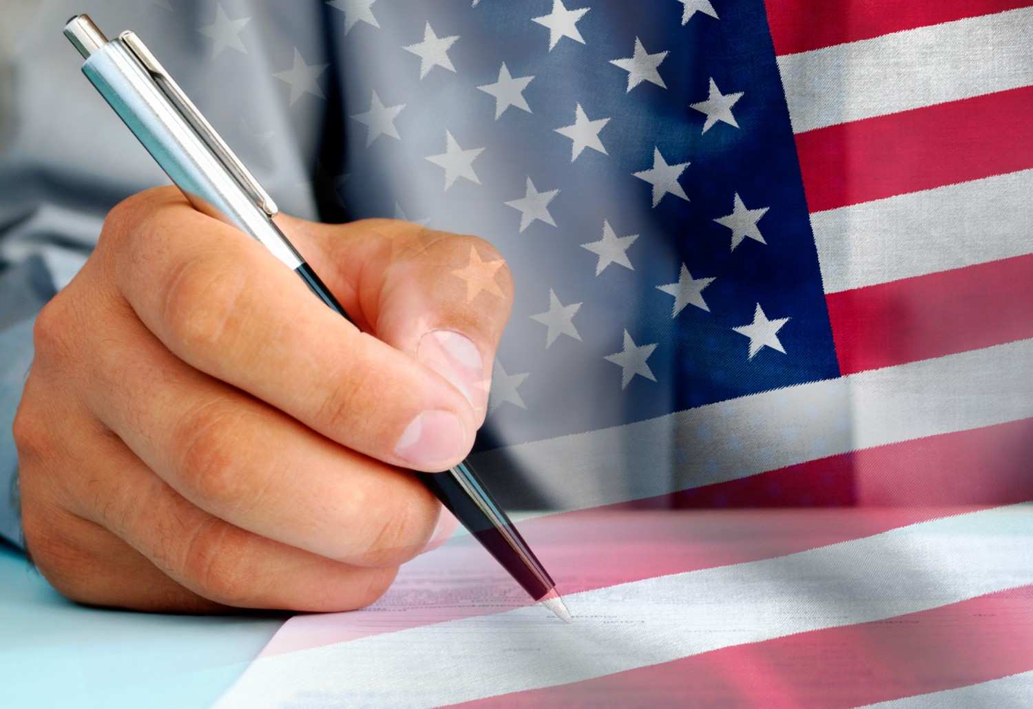H-1B visa application form with American flag and legal documents on desk