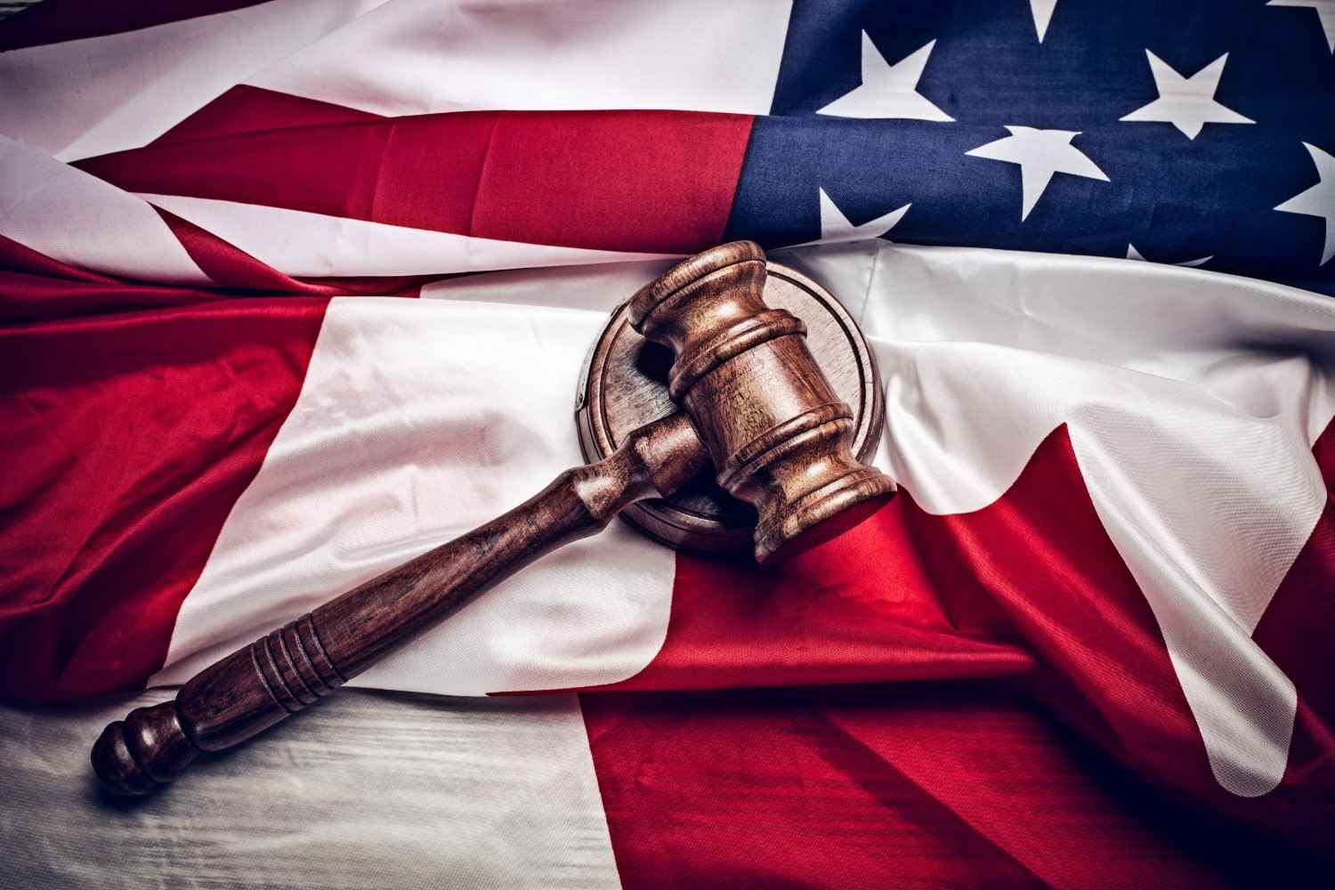 Motion to Dismiss immigration case strategy with judge's gavel on U.S. flag background.