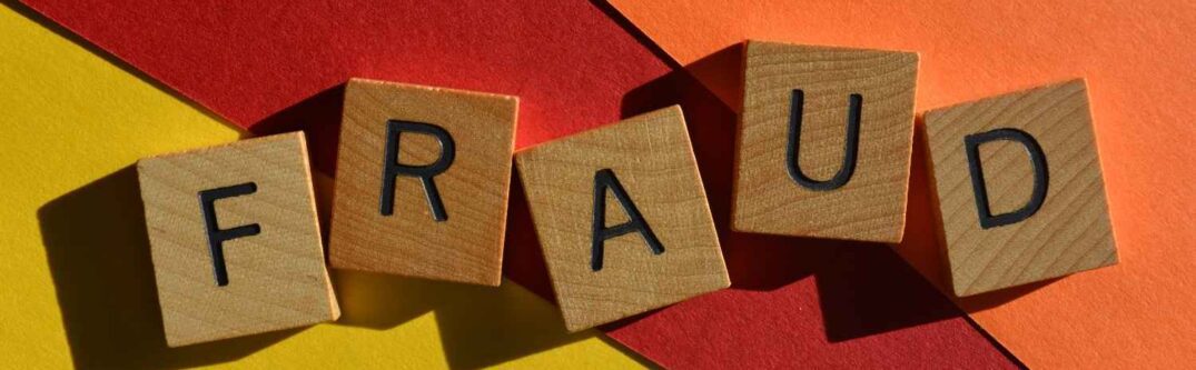 Challenge DHS fraud finding visa denial concept with wooden letter tiles