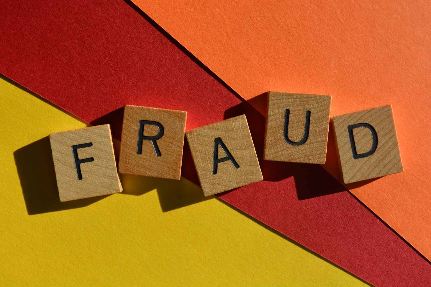 Challenge DHS fraud finding visa denial concept with wooden letter tiles