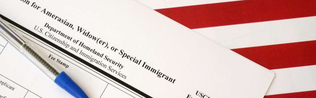 USCIS Form I-360 Petition on American flag background for immigration legal filing