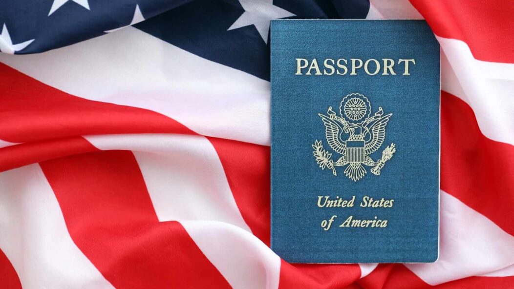 U.S. passport on the American flag background.