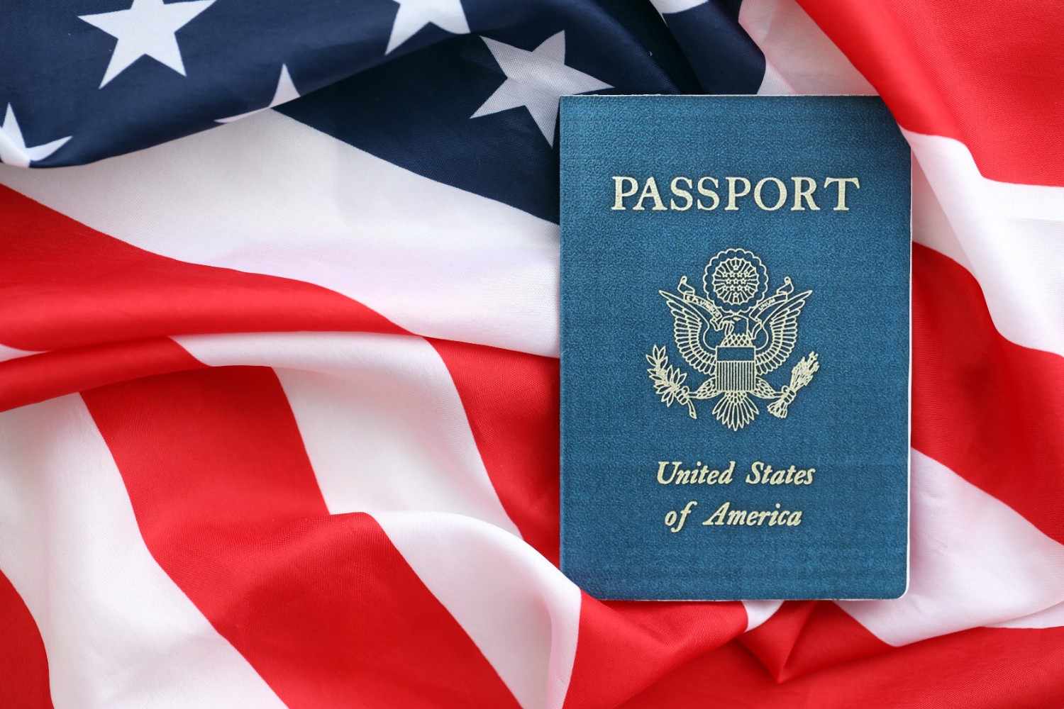 U.S. passport on the American flag background.