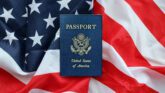 U.S. passport on the American flag background.
