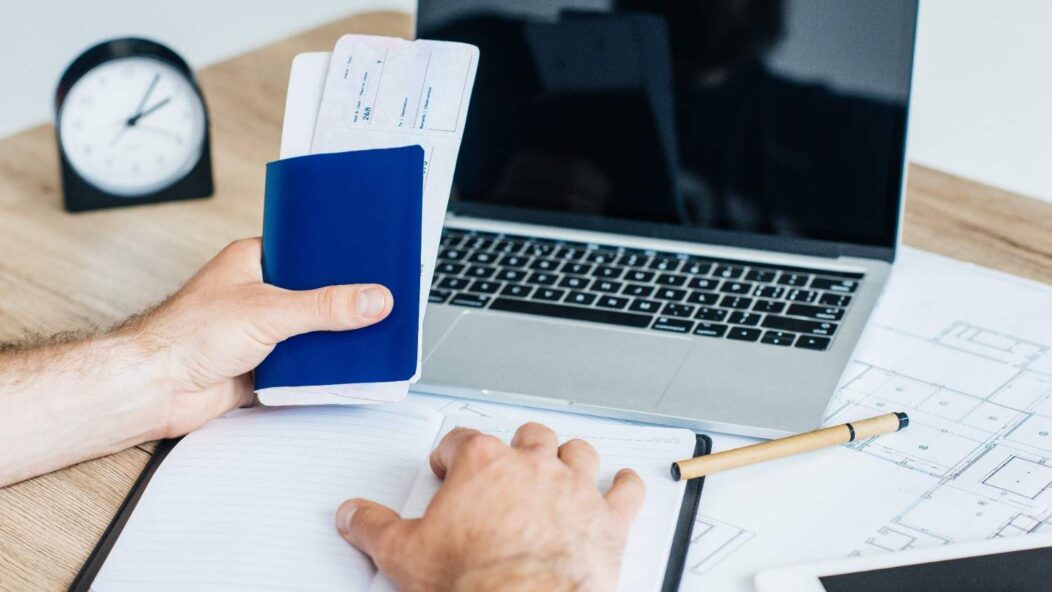 Hand removing blocks labeled 'RISK' symbolizing risk management in immigration compliance and audits