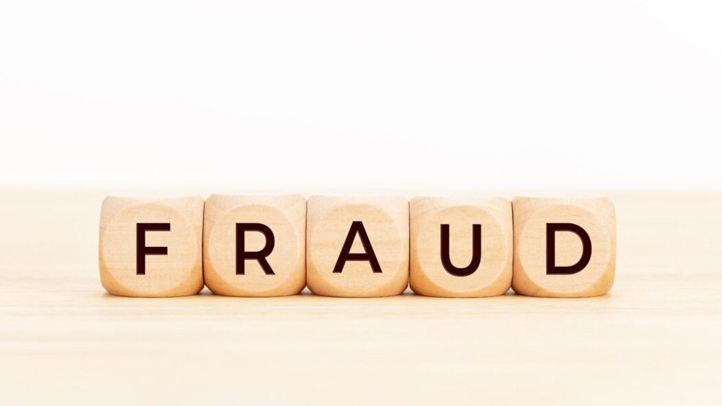 Magnifying glass over the word FRAUD highlighting OPT visa misrepresentation concerns