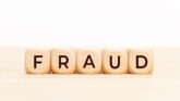 Magnifying glass over the word FRAUD highlighting OPT visa misrepresentation concerns
