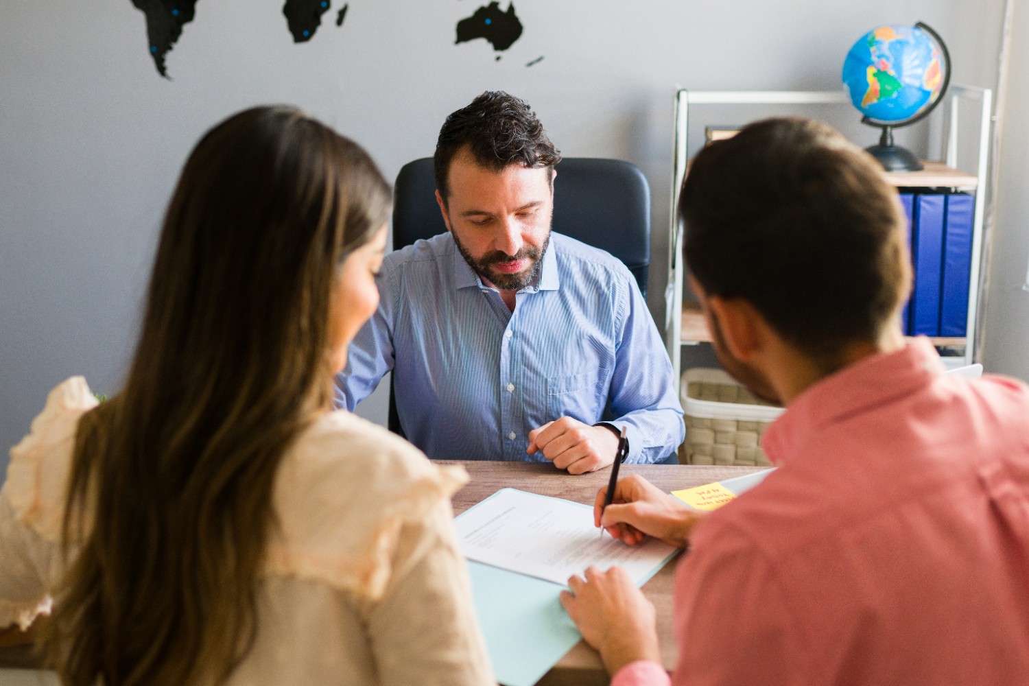 Immigration lawyer near me helping couple with visa paperwork
